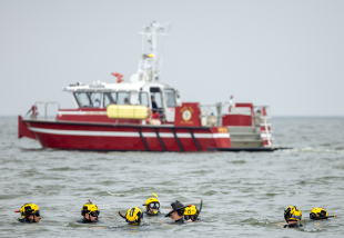 Rescue swimmers in the open ocean